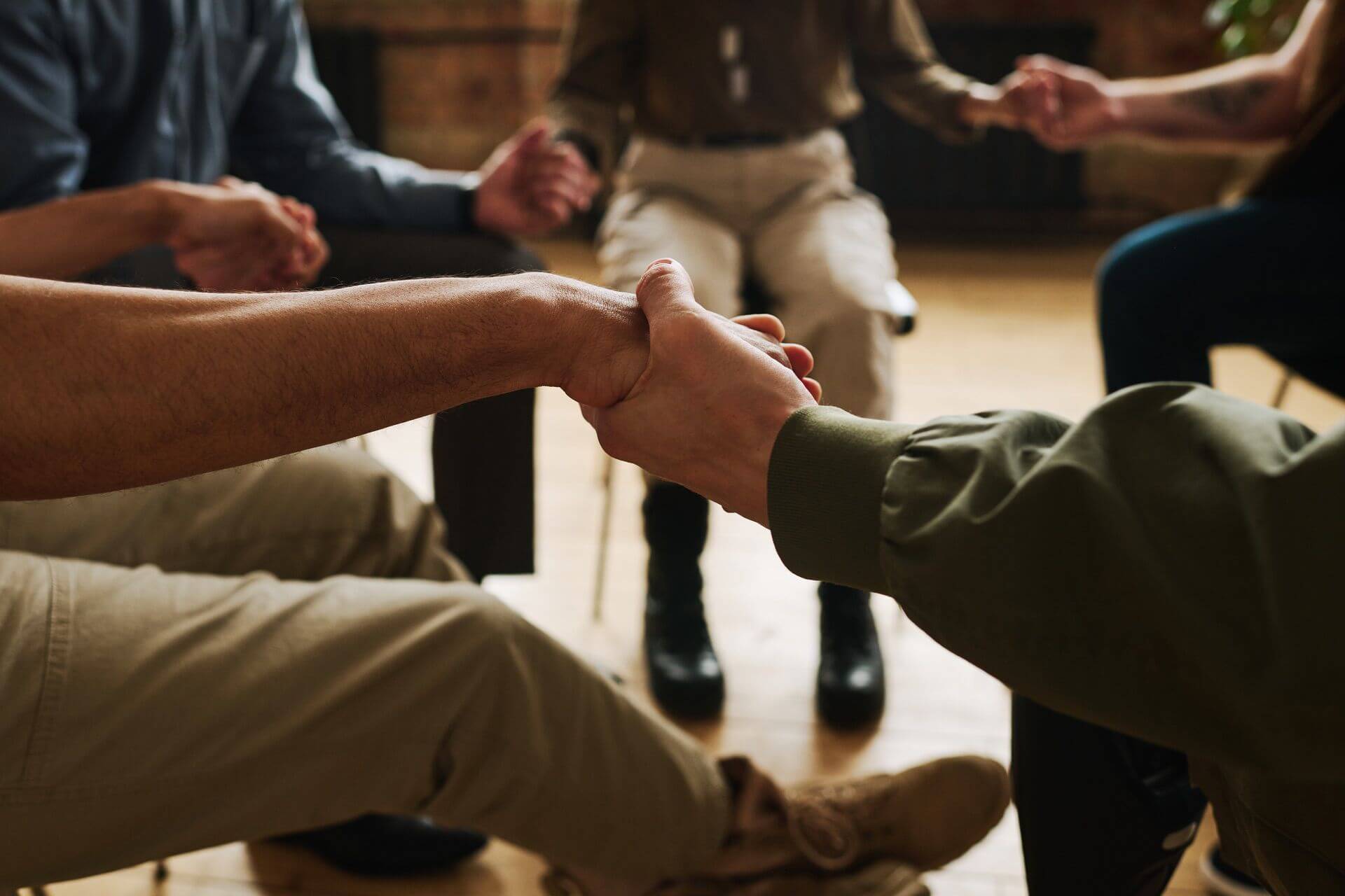 hands several people attending psychological support group during session 1